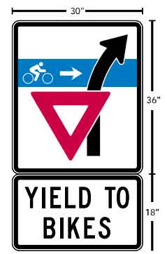 This was a road sign for Entrance ramps instructing motorists to yield to cyclists as they turn their car right to enter roadway such as an offramp from an interstate highway.