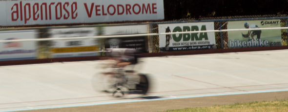 Alpenrose Velodrome Challenge looking across infield as bicycle sprinters streak by